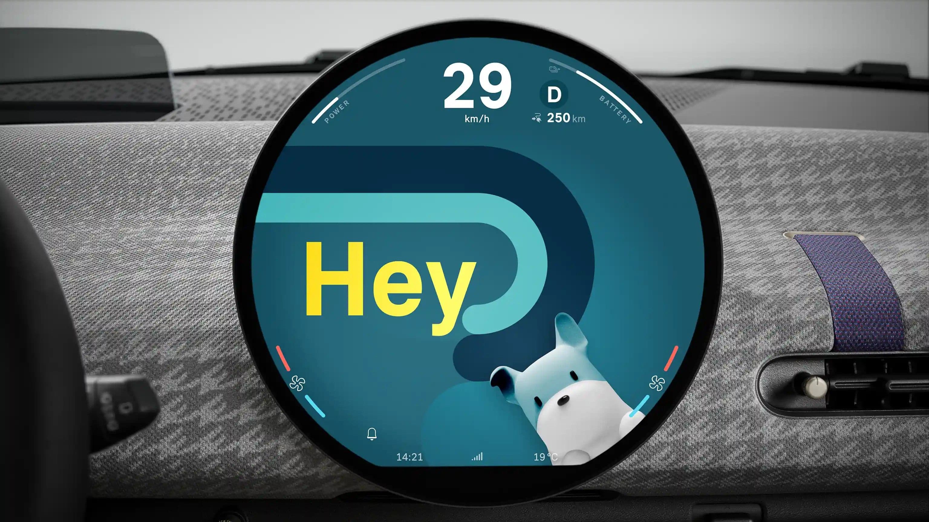 Car dashboard display shows "Hey" with a cartoon dog character.